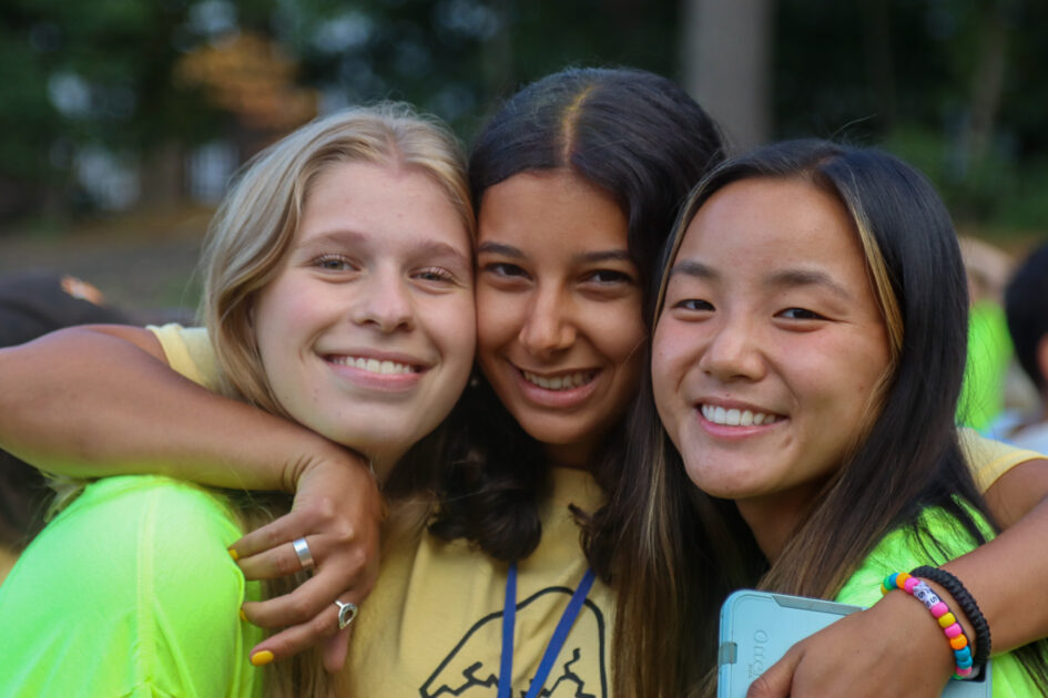 2 girls smiling for a photo.