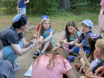 campers talking to a staff member.